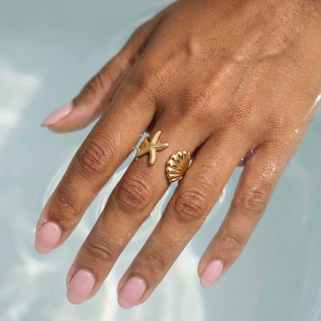 gold nautical ring with starfish and seashell motifs