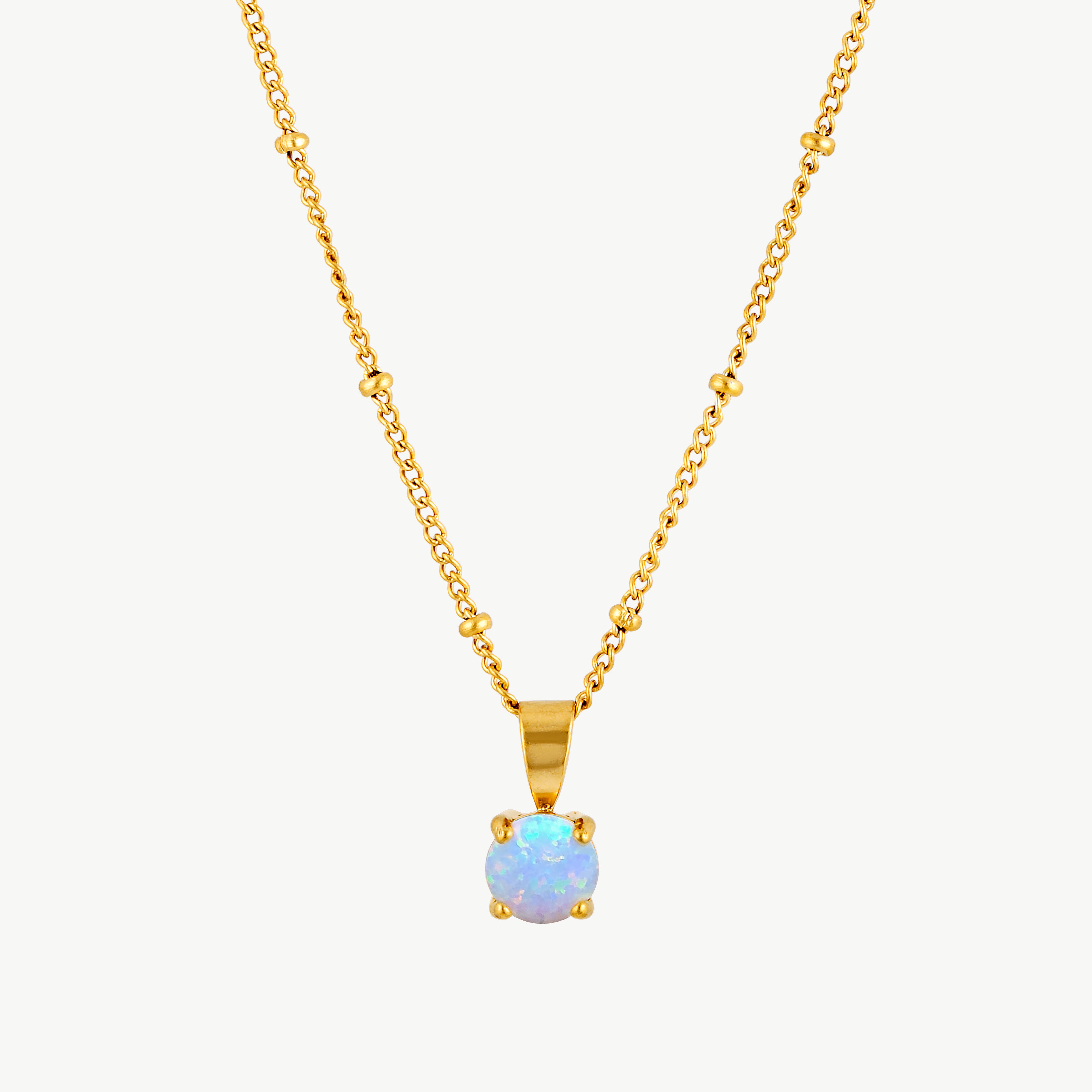 opal pendant necklace with luminous blue opal stone in a delicate four prong gold setting suspended from a fine gold chain