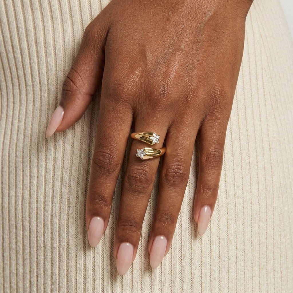 open star gold ring with sparkling stone set stars and a smooth polished finish 