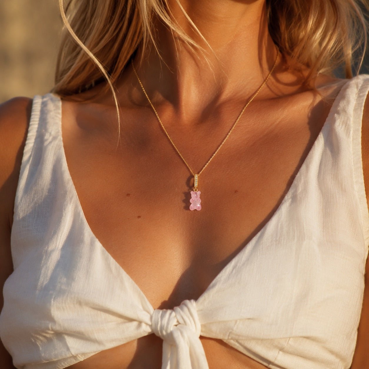 pink teddy bear necklace with enamel pendant and cubic zirconia crystals