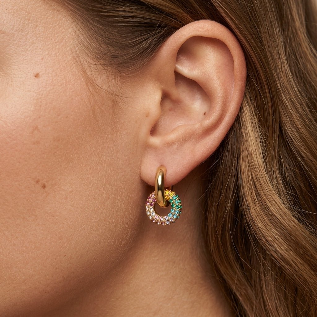 rainbow crystal earrings with a gold hoop and multicolor circle charm