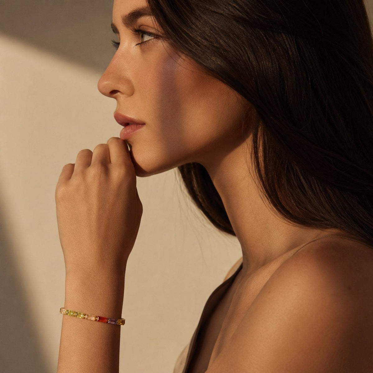 rainbow CZ gold bracelet featuring multicolor baguette cubic zirconia stones in a delicate design