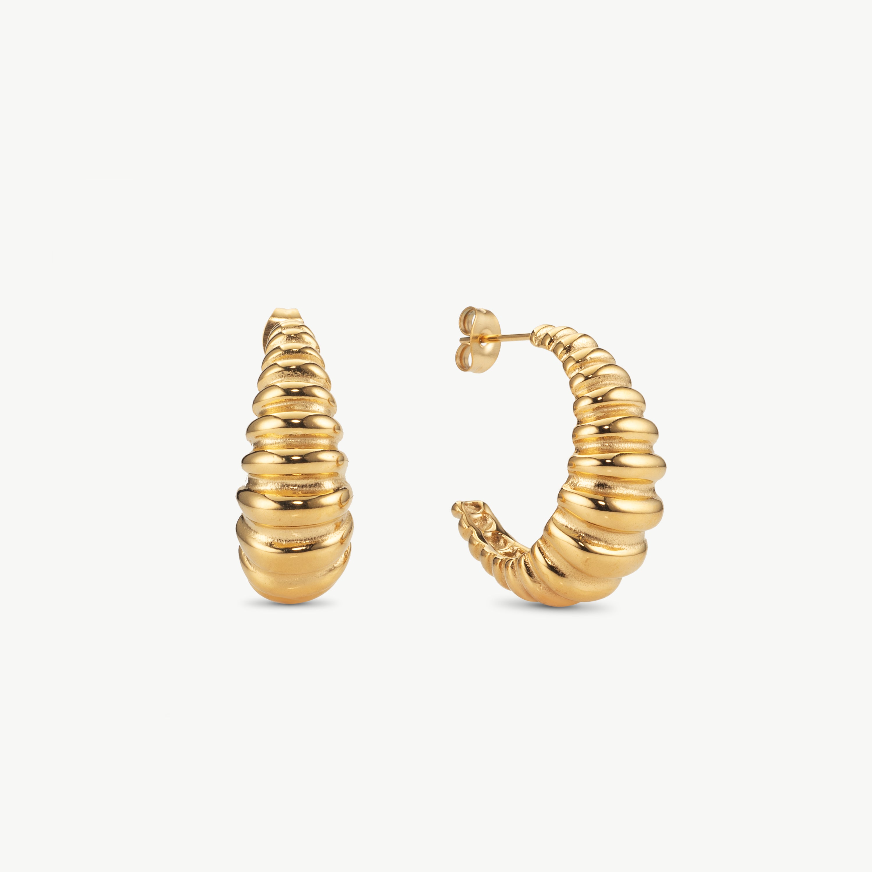 ribbed hoop earrings in gold with textured ridged surface, bold modern hoop earrings with sculptural shape and polished finish