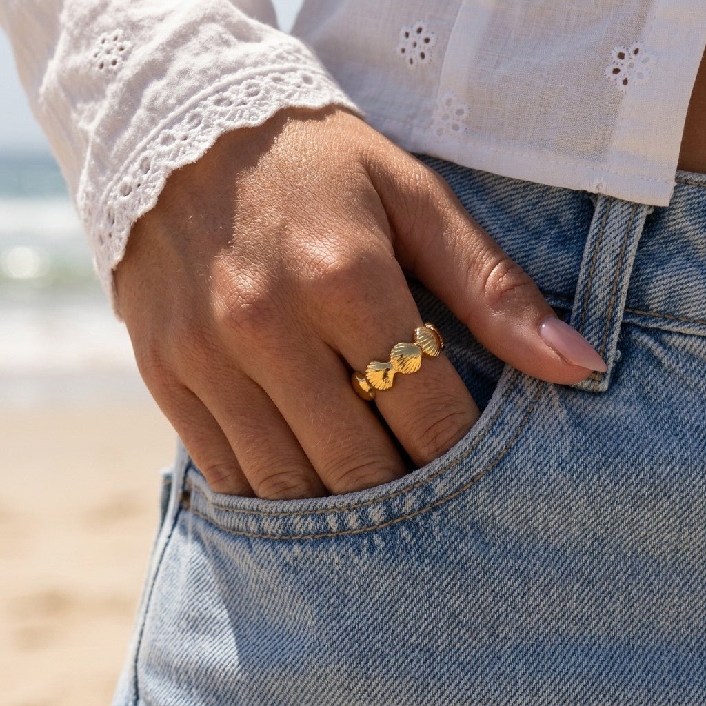 scallop shell gold ring with textured fan shaped details and a polished open band