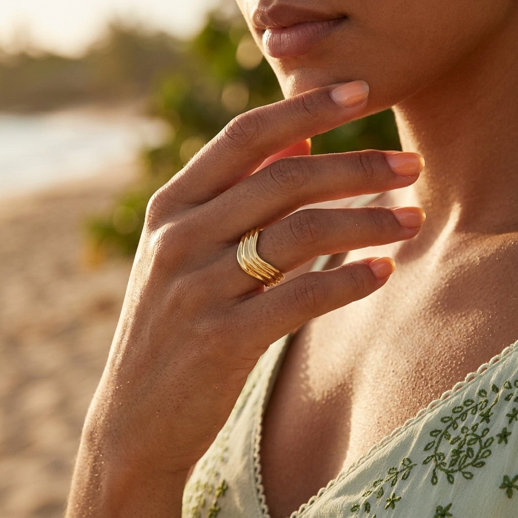 sculptural wave ring with layered gold bands and an elegant flowing silhouette