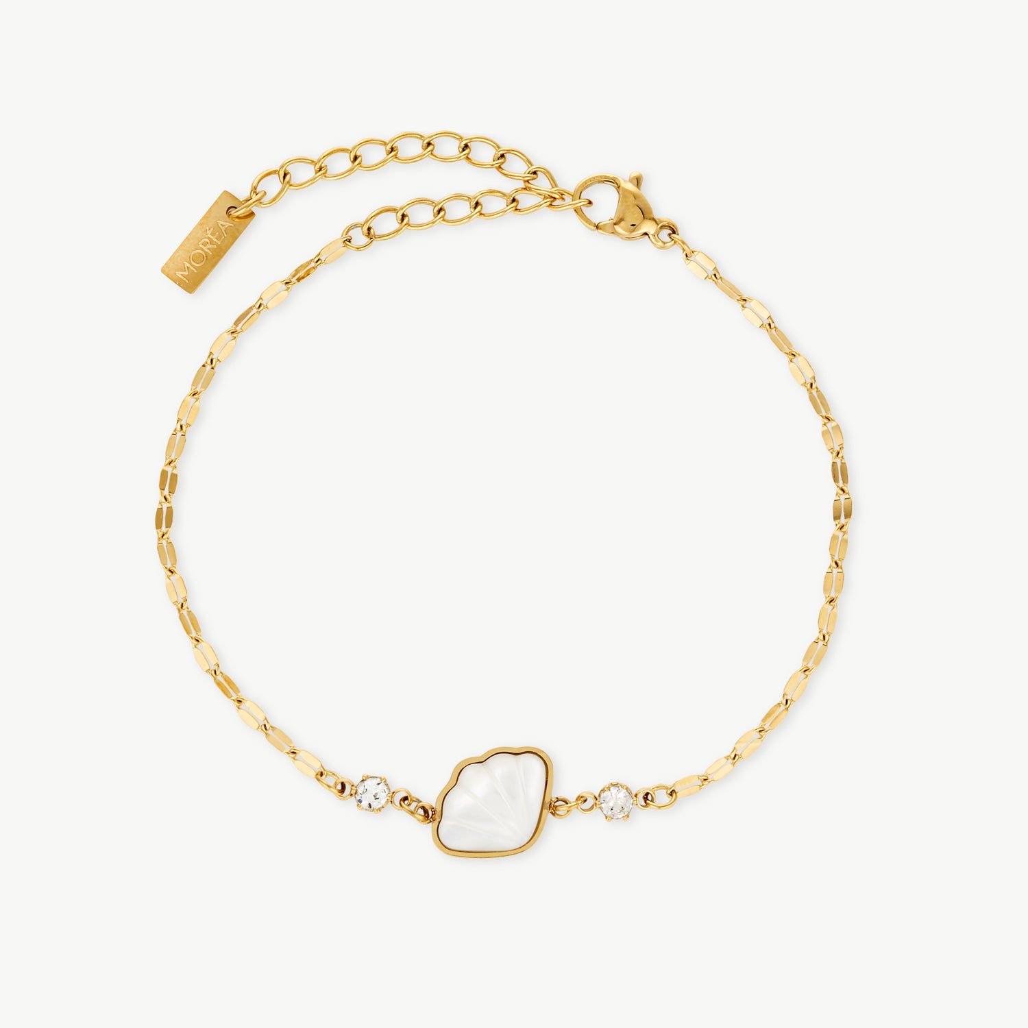 seashell charm bracelet with a mother of pearl scallop shell charm and premium cubic zirconia
