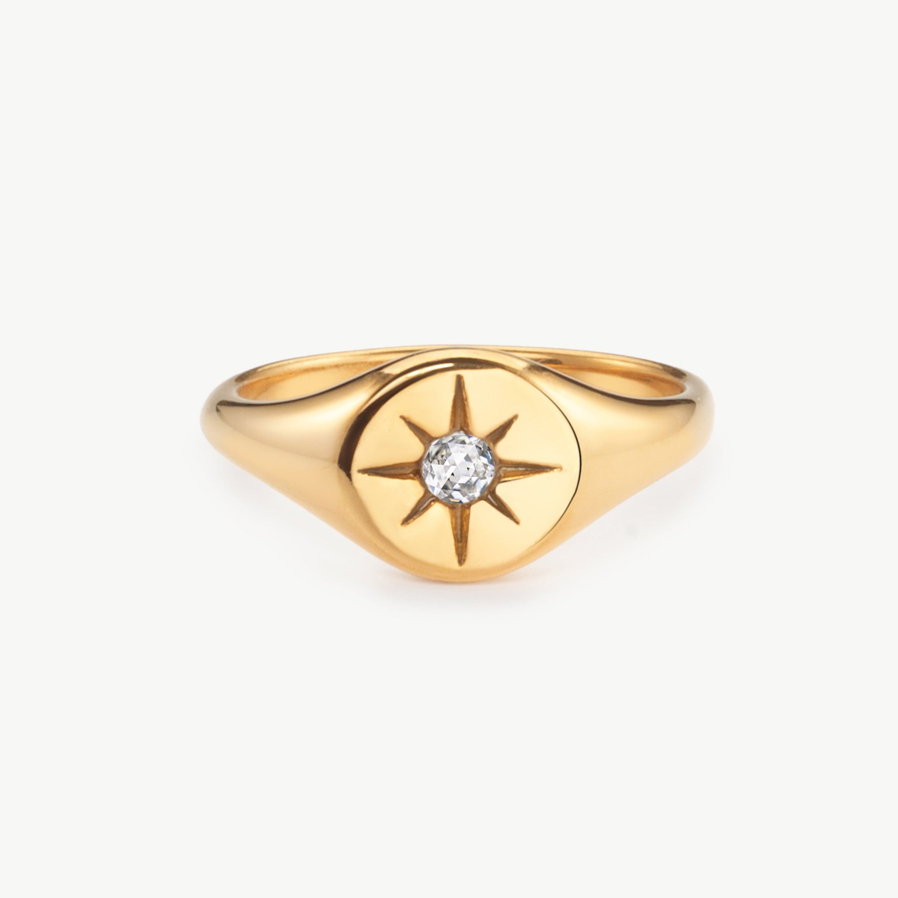star signet ring in gold with engraved star detail, gold star signet ring and north star signet ring with polished surface and minimalist celestial styling
