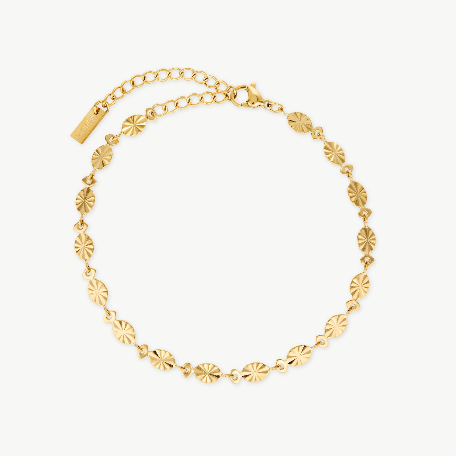 sunburst bracelet with polished gold sunburst discs on a delicate chain