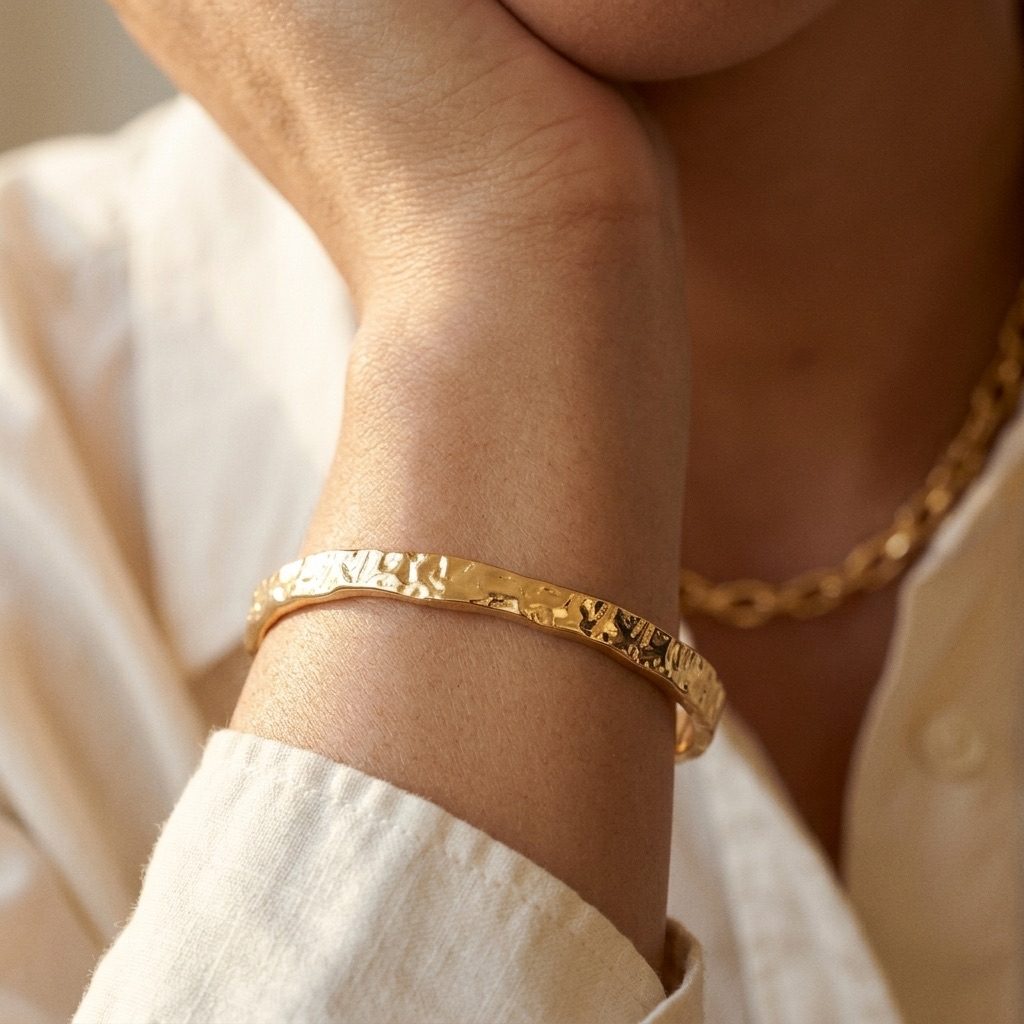textured gold bangle bracelet featuring a hammered finish and sleek minimalist design