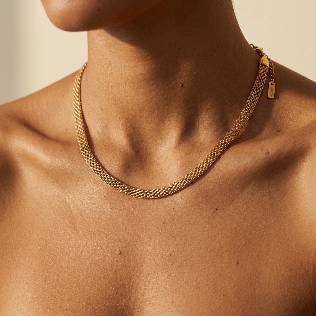textured gold chain necklace with a detailed woven mesh construction and elegant polished finish