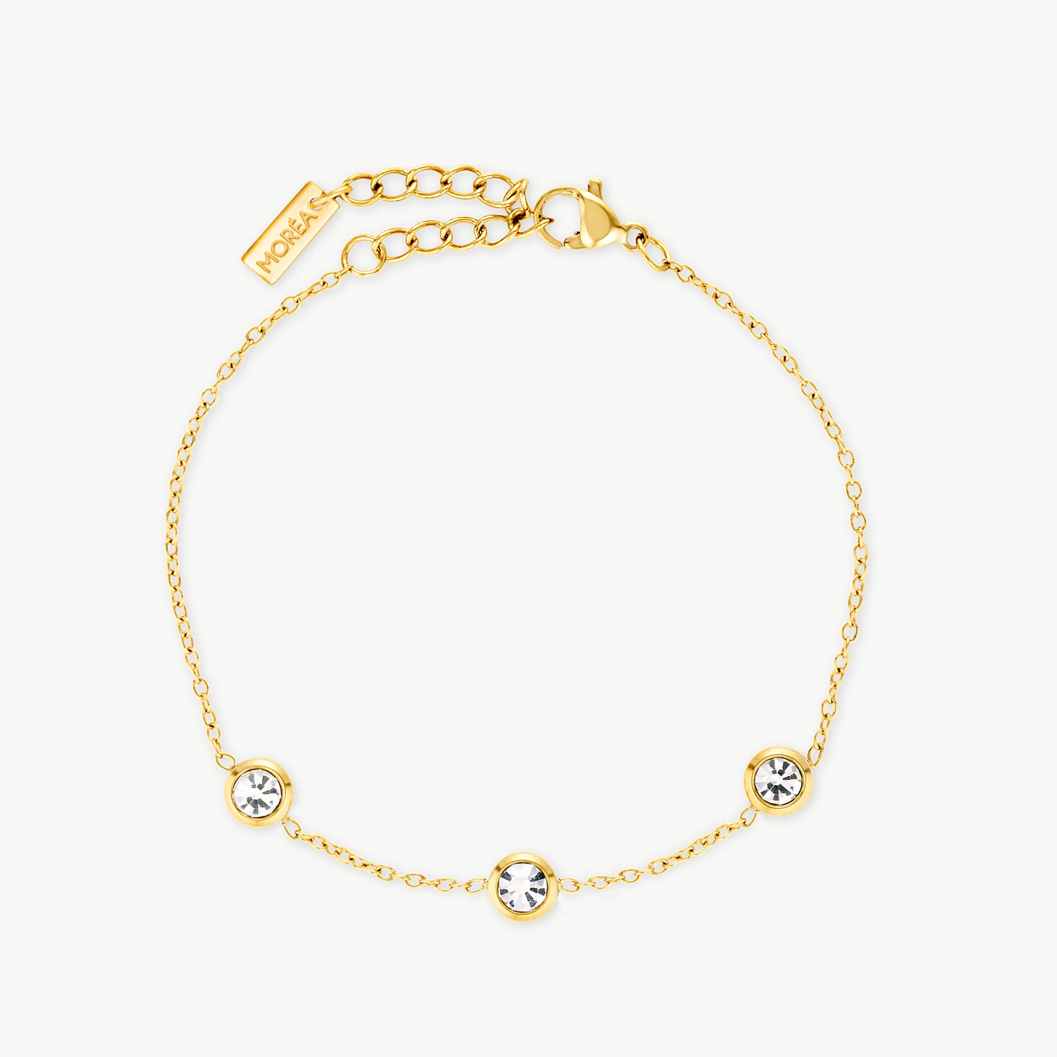 three stone bracelet with cubic zirconia stones on a delicate gold chain creating an elegant dainty bracelet