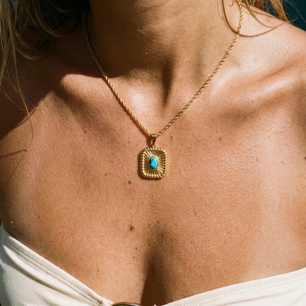turquoise and gold necklace featuring vibrant blue turquoise stone