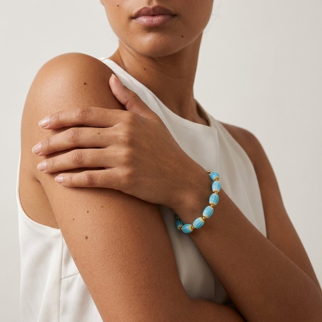 turquoise blue bead bracelet for women with striped beads and gold accents