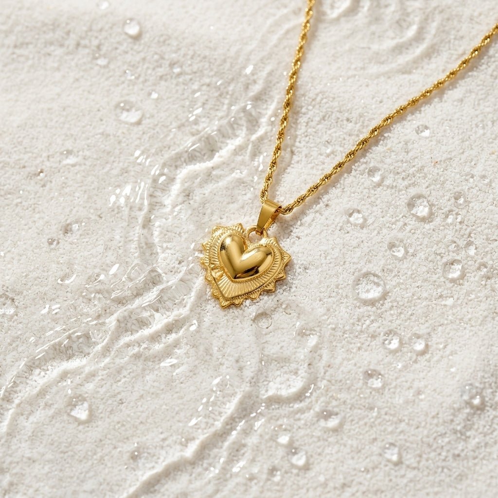 vintage style puffy heart necklace with an ornate gold pendant