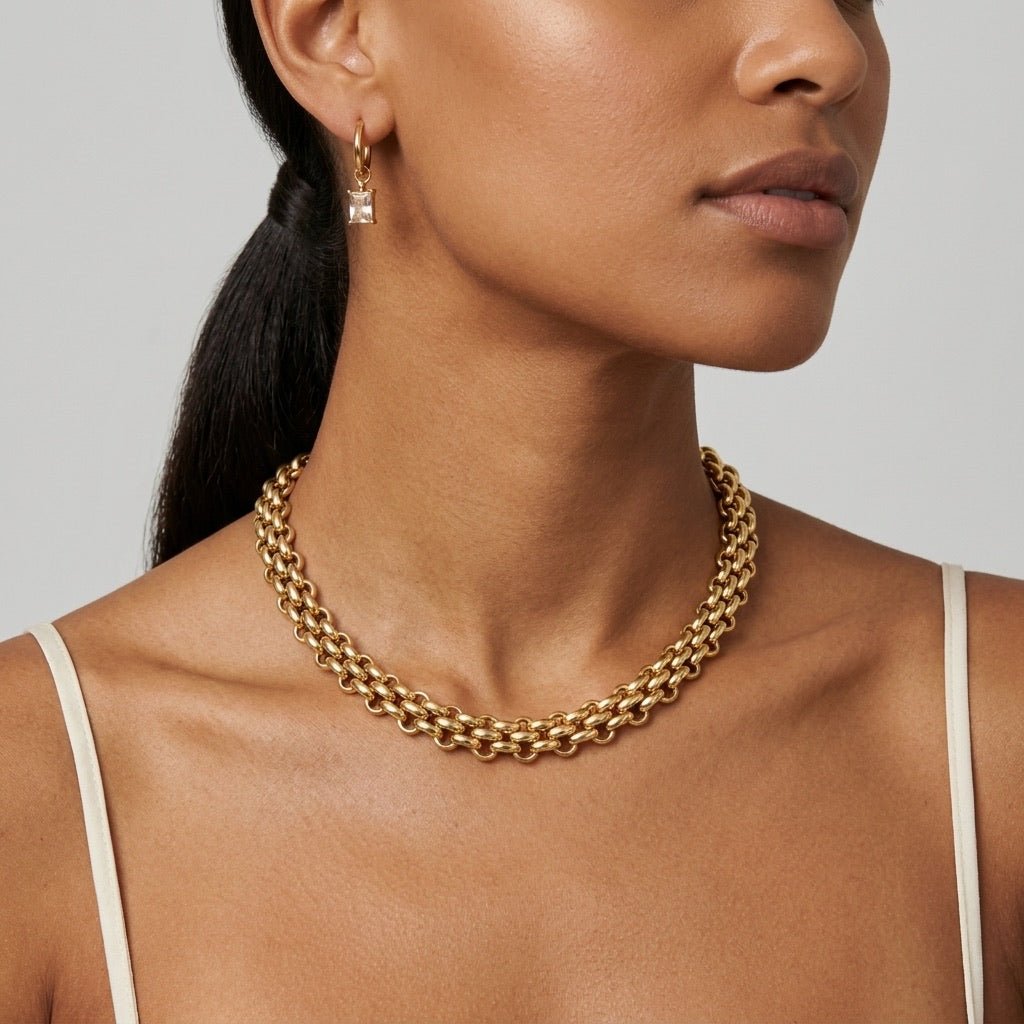 wide gold choker necklace with bold statement design for women
