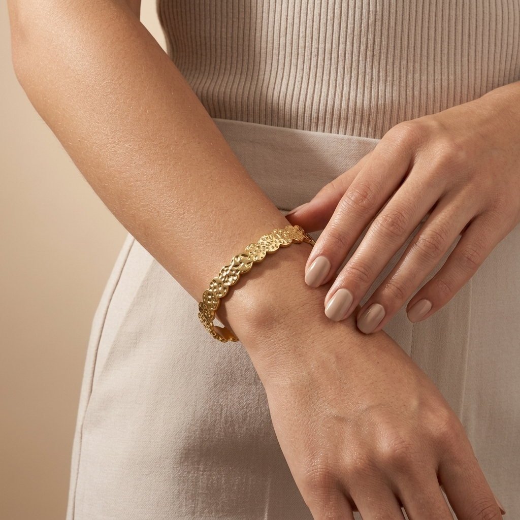women's textured gold bangle bracelet with hammered circular details